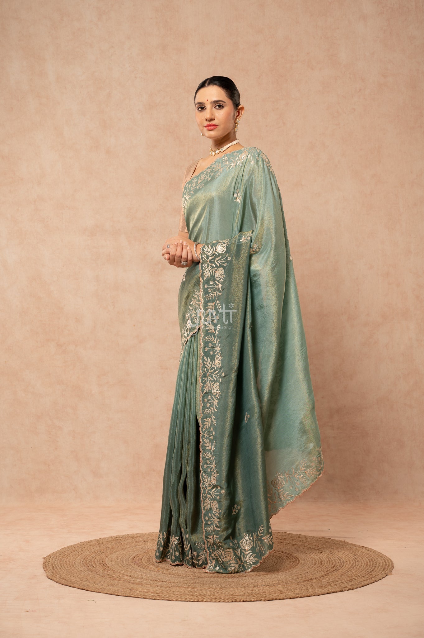 Mate Green Shaded Viscose Tissue Aari Border Motifs (Butti) Saree