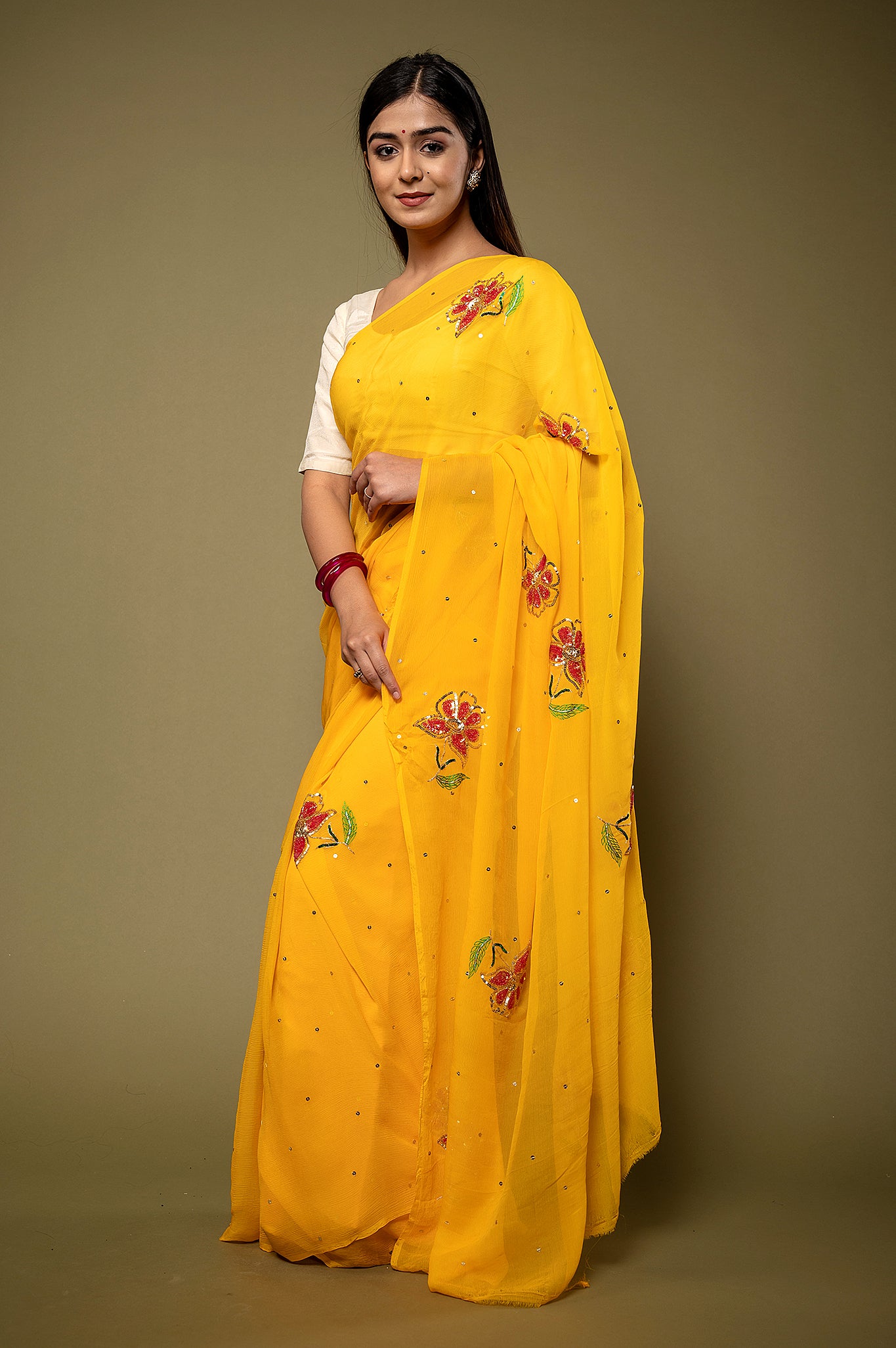 Yellow viscose chiffon sequins resham motif handwork party wear saree