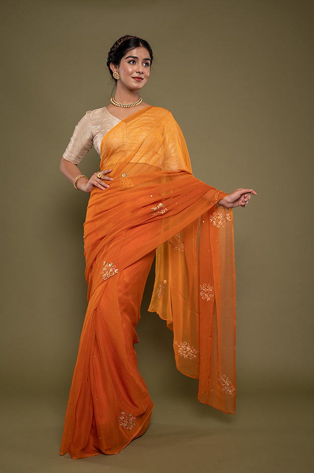 kesariya viscose chiffon aari sequins motif handwork saree