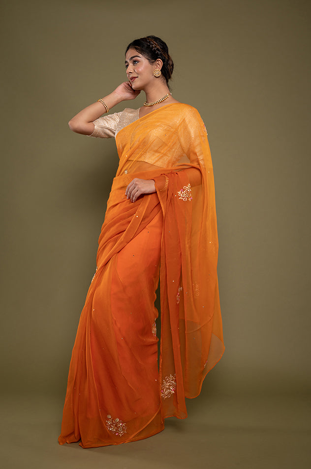 kesariya viscose chiffon aari sequins motif handwork saree