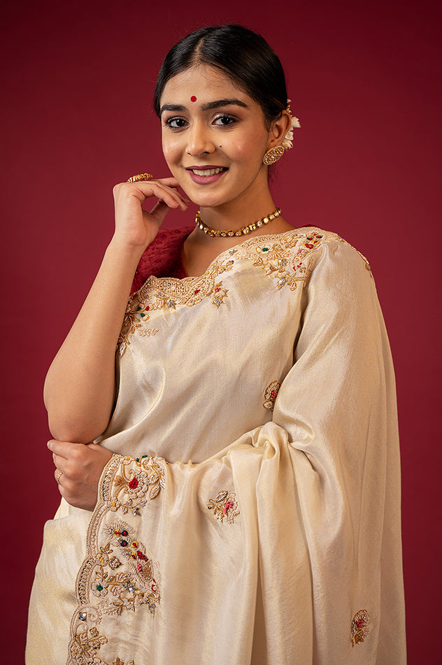 Cream pure tissue zardozi resham border butti handwork saree